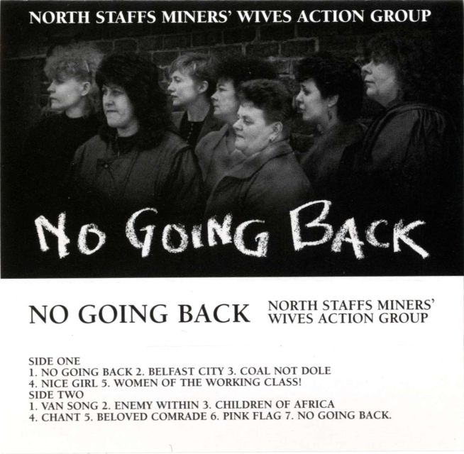 Black and white photograph of seven women from the North Staffs Miners’ Wives Action Group, including Rose Hunter, Bridget Bell, and Brenda Procter. The women are standing, all facing left, looking into the distance with serious expressions. Below the image is the track listing for the cassette